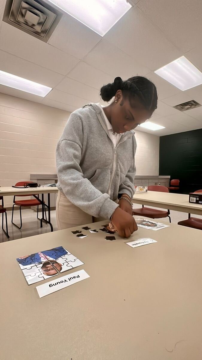 MYDG mentee solving puzzles