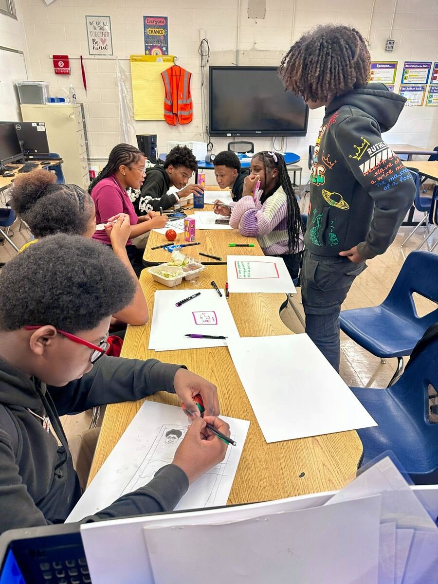 MYDG youth drawing in classroom